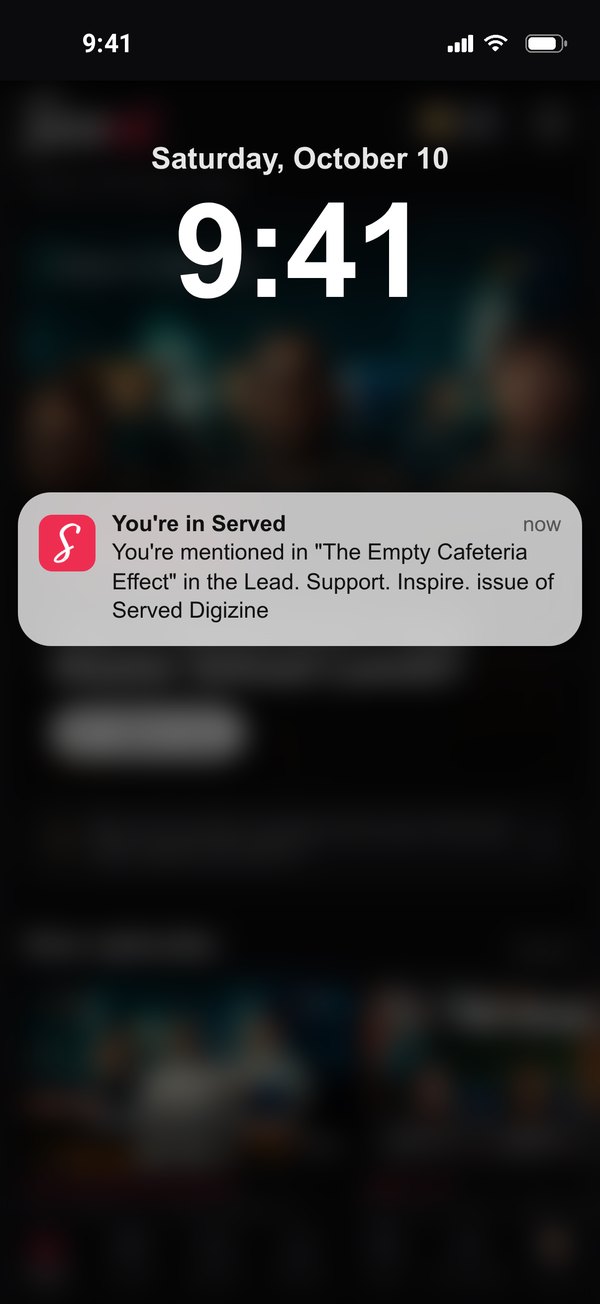 iPhone lock screen with a Served push notification that reads You're mentioned in The Empty Cafeteria Effect in the Lead. Support. Inspire. issue of Served Digizine